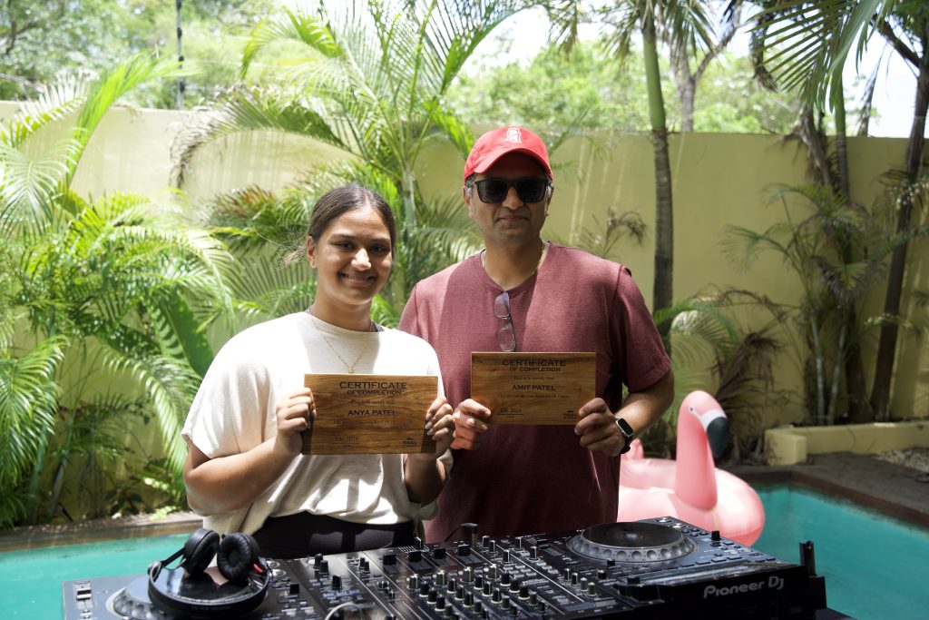 Two students with certificate of completion